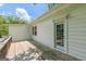 Wooden deck with a doorway and windows facing the backyard at 1493 Vesta Ave, Atlanta, GA 30337