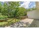 Wooden deck with black railings overlooking the backyard at 1493 Vesta Ave, Atlanta, GA 30337