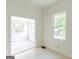 Open dining area connects seamlessly to the living room and boasts ample natural light at 1493 Vesta Ave, Atlanta, GA 30337
