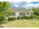 Charming one-story home surrounded by mature trees and a well-kept lawn at 1493 Vesta Ave, Atlanta, GA 30337