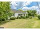 Well-maintained home with tidy landscaping and a welcoming covered front porch at 1493 Vesta Ave, Atlanta, GA 30337