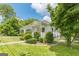 Quaint one-story home featuring a covered front porch and well-manicured landscaping at 1493 Vesta Ave, Atlanta, GA 30337