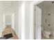 Bright hallway leads to a bathroom and other rooms in the home at 1493 Vesta Ave, Atlanta, GA 30337