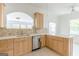 Modern kitchen boasts stainless steel appliances, granite countertops, and tile flooring at 1493 Vesta Ave, Atlanta, GA 30337