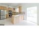 Well-designed kitchen with stainless steel appliances, island with countertop, and ample cabinet space at 1493 Vesta Ave, Atlanta, GA 30337