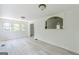 A spacious living room features white walls, new floors, and pass-through to another room at 1493 Vesta Ave, Atlanta, GA 30337