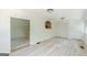 Open living room features white walls, new floors, and a pass-through into the kitchen at 1493 Vesta Ave, Atlanta, GA 30337