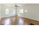 Inviting living room showcasing hardwood floors, bright windows, and a classic ceiling fan at 1493 Vesta Ave, Atlanta, GA 30337