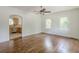 Spacious living room with hardwood floors and natural light with views into the kitchen at 1493 Vesta Ave, Atlanta, GA 30337