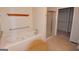 Bright bathroom featuring a jacuzzi tub and a separate walk in shower at 195 Twin Oaks Dr, Hampton, GA 30228