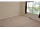 Bedroom featuring neutral walls, carpet flooring and a window with curtains at 195 Twin Oaks Dr, Hampton, GA 30228