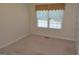 Bedroom featuring neutral walls, carpet flooring and a window with curtains at 195 Twin Oaks Dr, Hampton, GA 30228