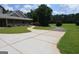 Charming home with a long driveway, beautiful landscaping, and inviting covered porch at 195 Twin Oaks Dr, Hampton, GA 30228