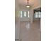 Welcoming foyer with a decorative front door, carpet flooring, and views into the living room at 195 Twin Oaks Dr, Hampton, GA 30228