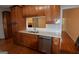 Kitchen features stainless steel appliances, wood cabinetry, and hardwood flooring throughout at 195 Twin Oaks Dr, Hampton, GA 30228