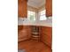 Kitchen cabinets with lazy susan and hardwood floors at 195 Twin Oaks Dr, Hampton, GA 30228