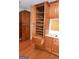 Kitchen features wood cabinetry and hardwood flooring at 195 Twin Oaks Dr, Hampton, GA 30228