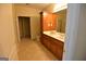 Main bathroom with double sinks and wood cabinets at 195 Twin Oaks Dr, Hampton, GA 30228