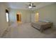 A spacious main bedroom with ceiling fan, carpet, and two closets at 195 Twin Oaks Dr, Hampton, GA 30228