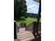 Scenic view from the porch featuring lush greenery, mature trees, and a tranquil setting at 195 Twin Oaks Dr, Hampton, GA 30228