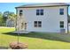 Spacious backyard with lush green grass and a newly planted tree, perfect for outdoor enjoyment at 363 Friendship Oak Way, Hampton, GA 30228