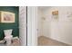 Half bathroom featuring a modern toilet and vanity as well as a walk in closet at 363 Friendship Oak Way, Hampton, GA 30228