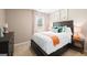 Comfortable bedroom with neutral walls, a plush carpet, and decorative accents on the neatly made bed at 363 Friendship Oak Way, Hampton, GA 30228