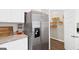 Modern kitchen featuring stainless steel appliances and a walk in pantry with wire rack shelves at 363 Friendship Oak Way, Hampton, GA 30228