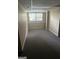 Finished basement space with carpet, neutral walls, window, and shelving at 4887 Winterview Ln, Douglasville, GA 30135