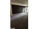 Spacious basement with neutral carpet and walkout access to the outdoors at 4887 Winterview Ln, Douglasville, GA 30135