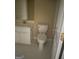 Cozy full bathroom featuring a toilet, vanity, and tile flooring at 4887 Winterview Ln, Douglasville, GA 30135