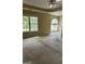 Bedroom with tray ceiling, large windows offering ample light at 4887 Winterview Ln, Douglasville, GA 30135