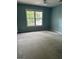 Bedroom with a ceiling fan and a large window allowing natural light at 4887 Winterview Ln, Douglasville, GA 30135