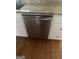 Stainless steel dishwasher and granite countertops sit atop hardwood floors at 4887 Winterview Ln, Douglasville, GA 30135
