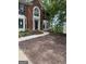 Attractive two-story brick home with manicured lawn and landscaped front yard at 4887 Winterview Ln, Douglasville, GA 30135