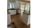 Bright kitchen with white cabinets, granite countertops, and stainless steel appliances at 4887 Winterview Ln, Douglasville, GA 30135