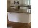 Kitchen island with hardwood floors and white cabinets and granite countertops at 4887 Winterview Ln, Douglasville, GA 30135