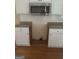 Kitchen with white cabinets, backsplash, and granite countertops at 4887 Winterview Ln, Douglasville, GA 30135
