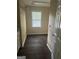 Bright laundry room with a countertop and white trim at 4887 Winterview Ln, Douglasville, GA 30135