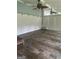 Bright living room with tile floors, wainscoting, and ceiling fans at 4887 Winterview Ln, Douglasville, GA 30135