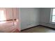 Unfinished basement space with support beams, window with natural light, and visible utility lines ready to be renovated at 2138 Rachael Se St, Atlanta, GA 30315