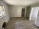 Bedroom showcasing bare walls, new floors and a window with natural light at 2138 Rachael Se St, Atlanta, GA 30315