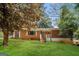 Charming brick home featuring a cozy front porch and lush green lawn at 2138 Rachael Se St, Atlanta, GA 30315