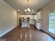 Spacious kitchen featuring stainless steel appliances, a kitchen island, and hardwood floors at 542 Hinton Farm Way, Dacula, GA 30019