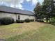 Spacious backyard and brick exterior at 6409 Caledon Ct, Locust Grove, GA 30248