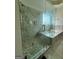 Opulent bathroom with seamless glass shower, soaking tub, and marble accents, creating a spa-like retreat at 6409 Caledon Ct, Locust Grove, GA 30248