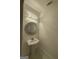 Elegant powder room features a decorative mirror and pedestal sink at 6409 Caledon Ct, Locust Grove, GA 30248