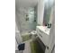 Modern bathroom featuring a walk-in shower, hexagon tile flooring, and a vanity with a gray countertop at 6409 Caledon Ct, Locust Grove, GA 30248