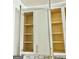 Kitchen cabinet with empty shelves and decorative gold hardware at 6409 Caledon Ct, Locust Grove, GA 30248