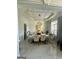 Elegant dining room featuring coffered ceiling and marble floors, perfect for entertaining at 6409 Caledon Ct, Locust Grove, GA 30248